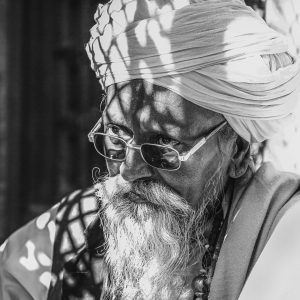 elderly-man-white-turban-dappled-light-rajasthan-india